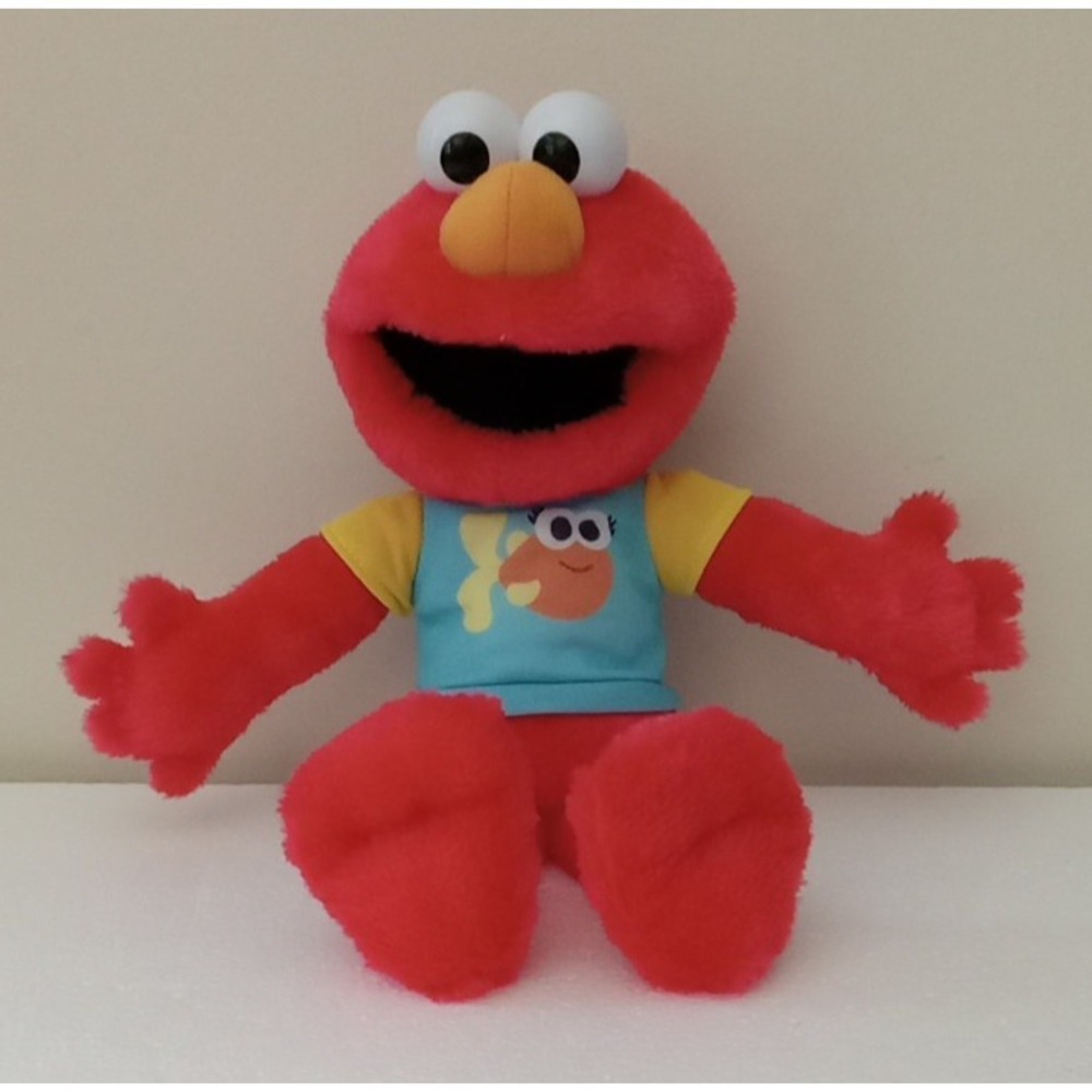 SESAME STREET 13-inch Sing-Along Plush Elmo with Lights and Sounds Works